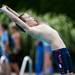A participant does a backward dive in the eight and under diving championships at The Racquet Club on Monday, July 22. Daniel Brenner I AnnArbor.com